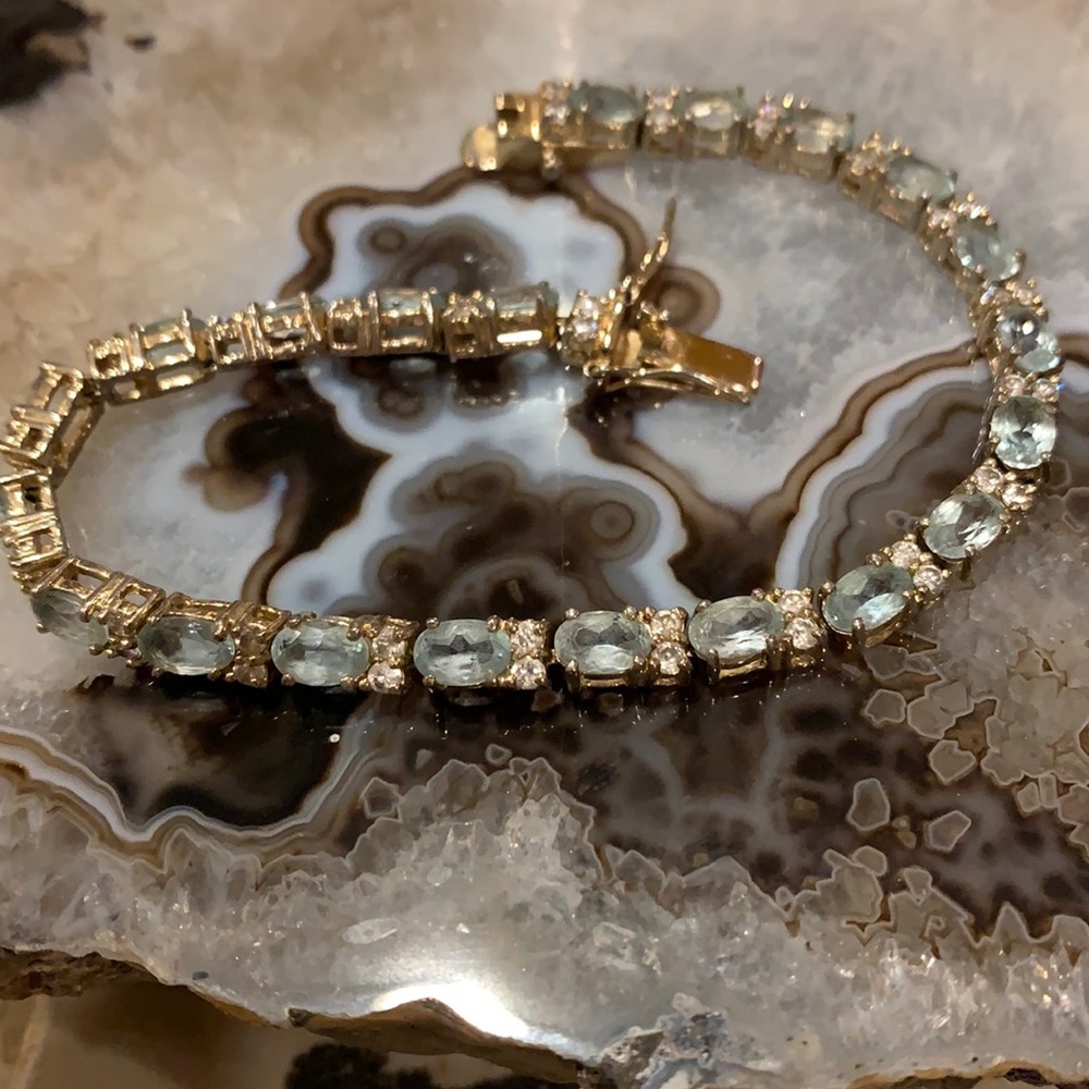 Gold tone blue and clear topaz link bracelet
